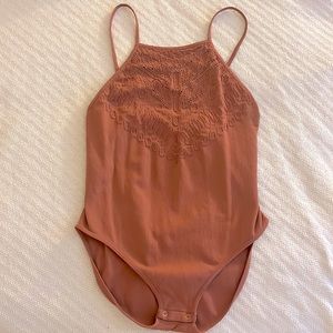 Free People intimates, stretch bodysuit.  Color is a brownish / pink, sienna.